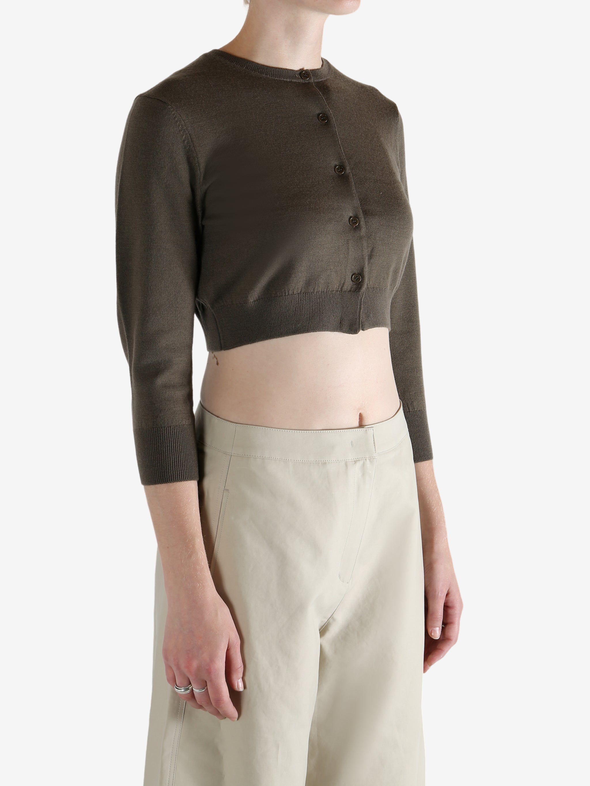 Brown cardigan worn by a person, showing the cardigan's fit