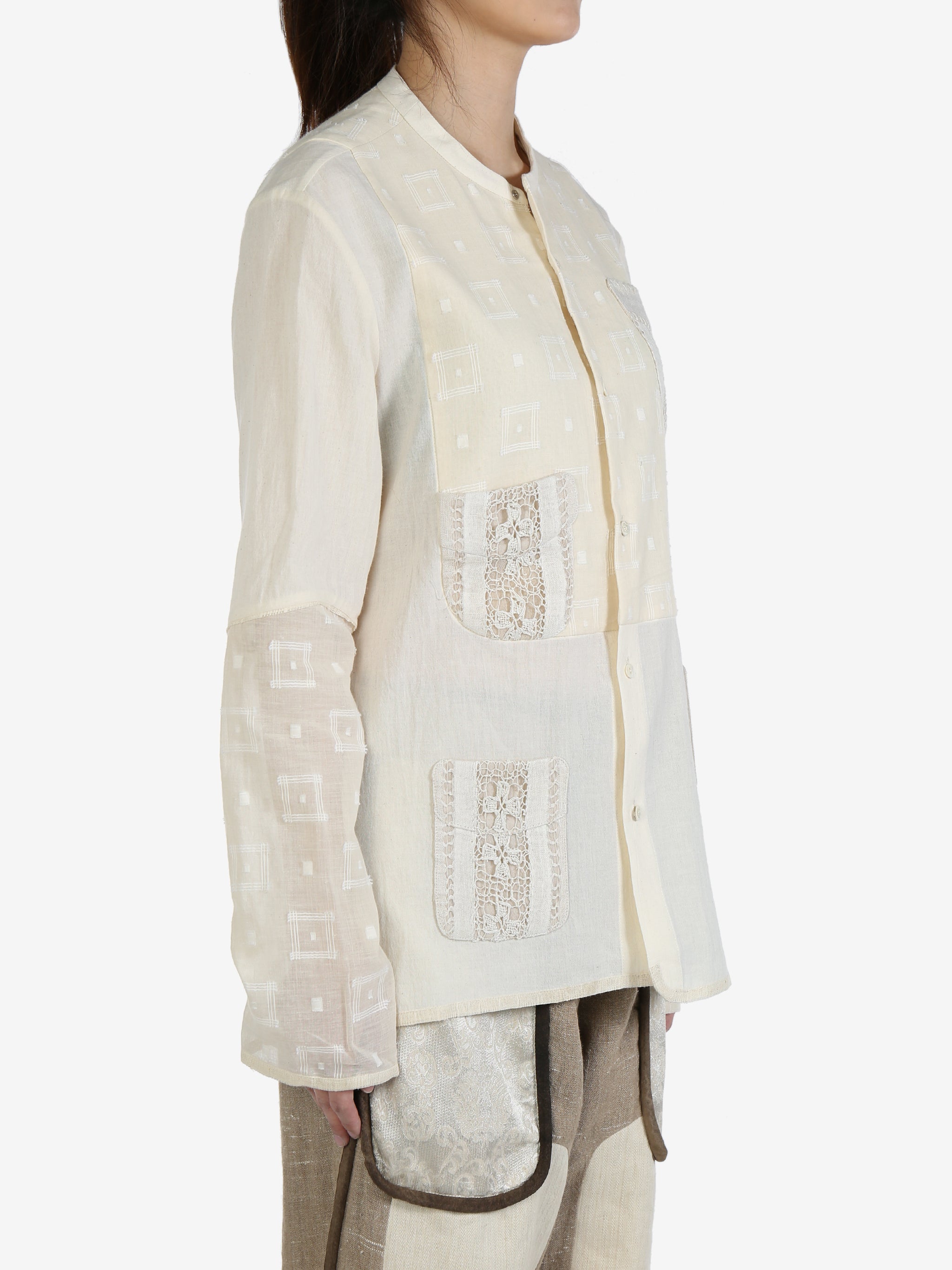 White shirt worn by a person, showing the shirt's fit