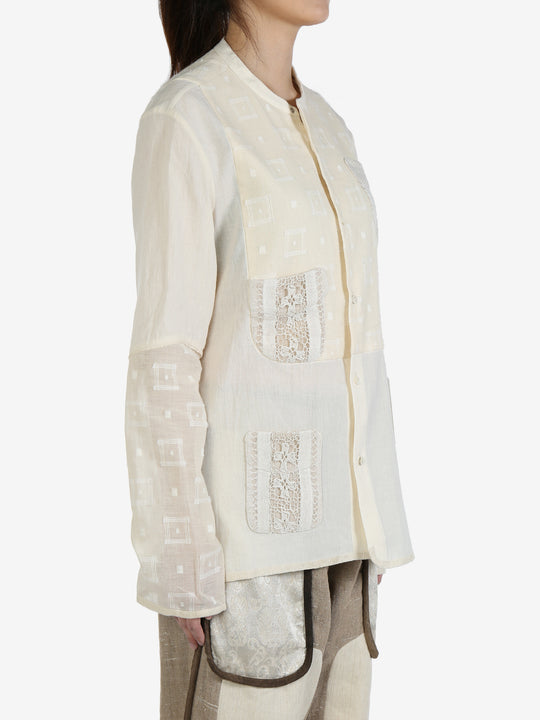 White shirt worn by a person, showing the shirt's fit