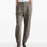 Green pants worn by a person, showing the pants fit