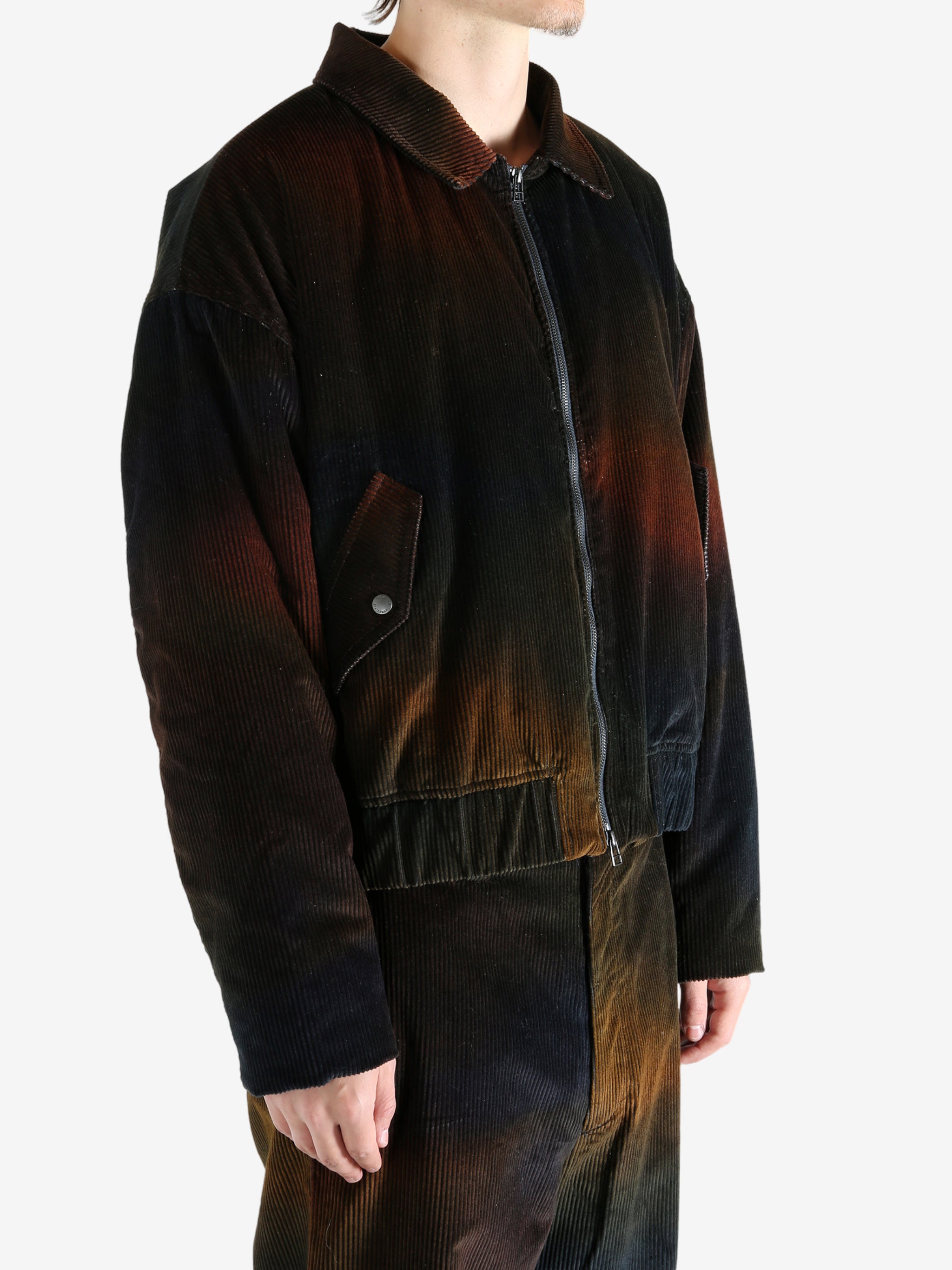 Black jacket worn by a person, showing the jacket's fit