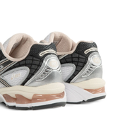 Close up of the white sneakers, showing texture of the fabric
