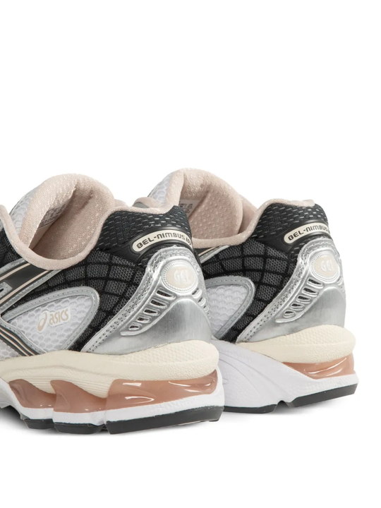 Close up of the white sneakers, showing texture of the fabric
