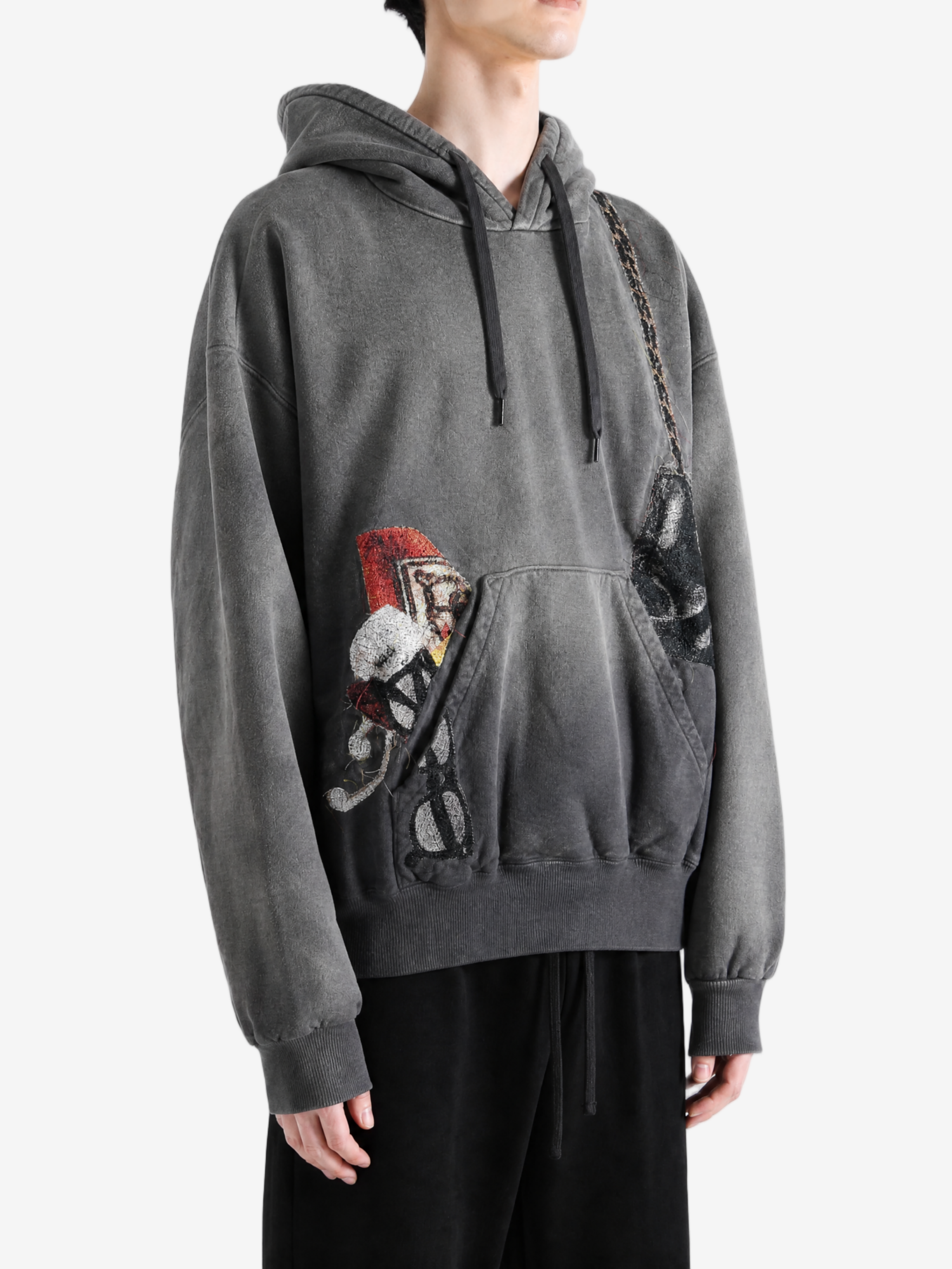 Grey jacket worn by a person, showing the jacket fit