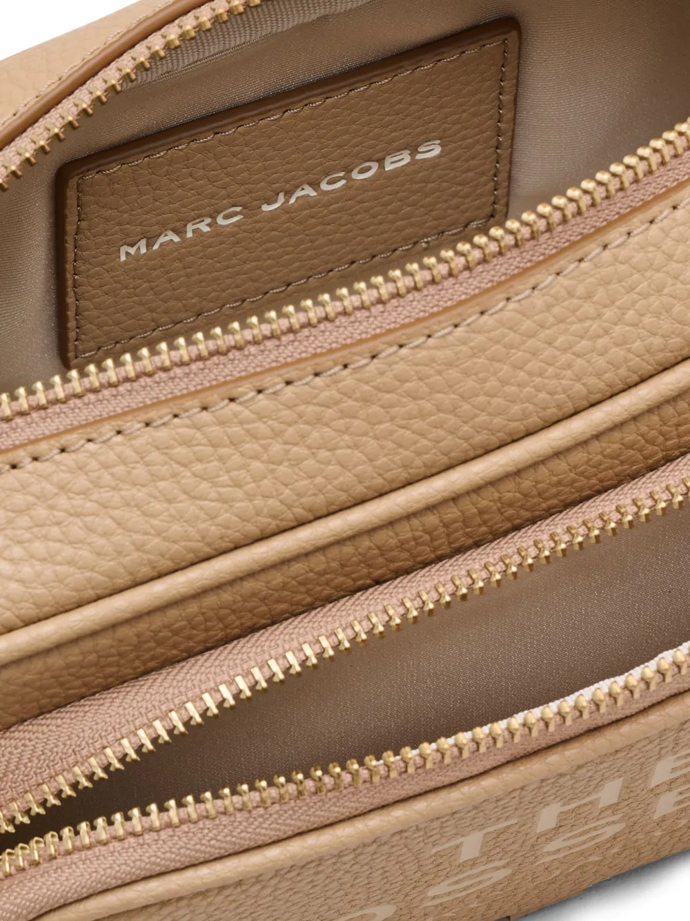 Close up of the brown bag, showing texture of the leather fabric