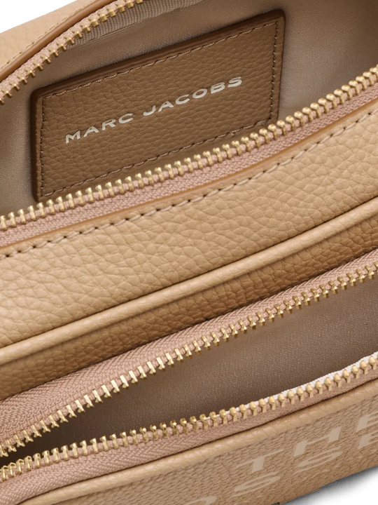 Close up of the brown bag, showing texture of the leather fabric
