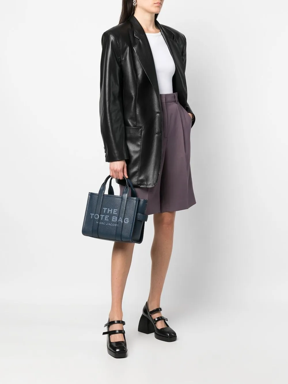 Blue bag worn by a person, showing the bag's fit