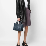 Blue bag worn by a person, showing the bag's fit