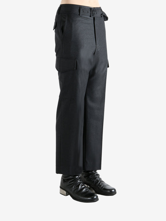 Black pant worn by a person, showing the pant's fit