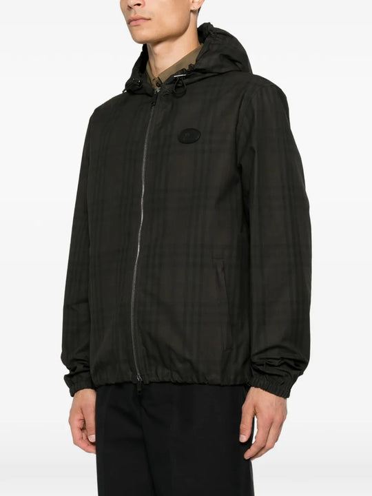Black jacket worn by a person, showing the jacket fit