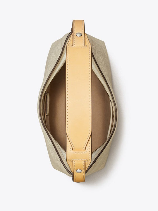 Close up of white bag, showing texture of the leather fabric