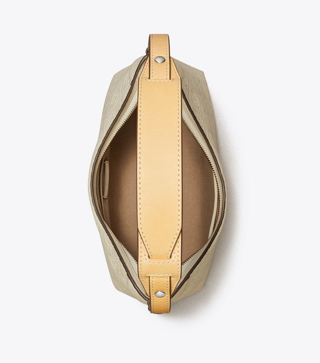 Close up of white bag, showing texture of the leather fabric