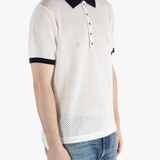 White shirt worn by a person, showing the shirt fit