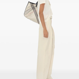 Tan top worn by a person, showing the top's fit