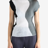 White shirt worn by a person, showing the shirt's fit