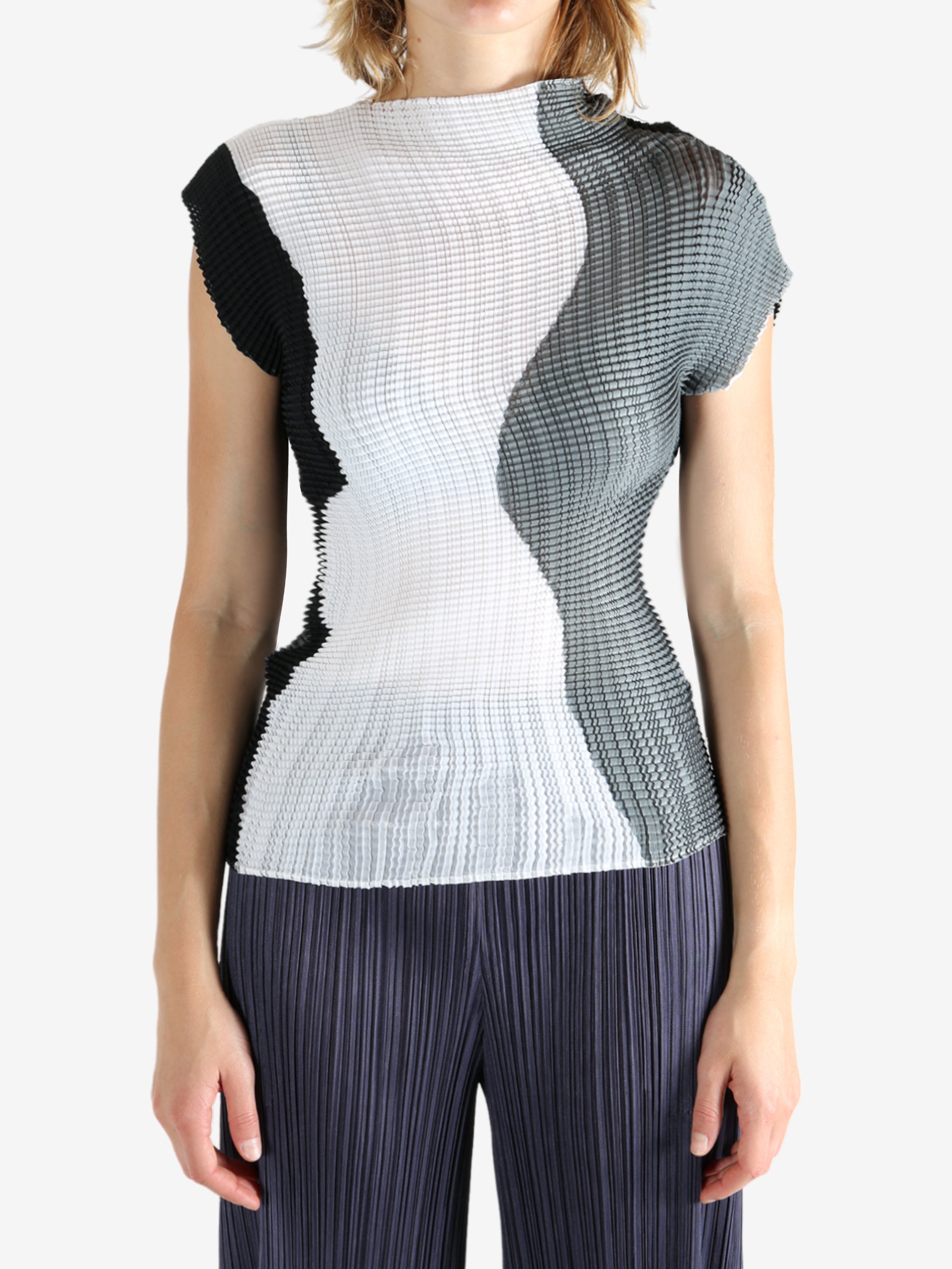 White shirt worn by a person, showing the shirt's fit