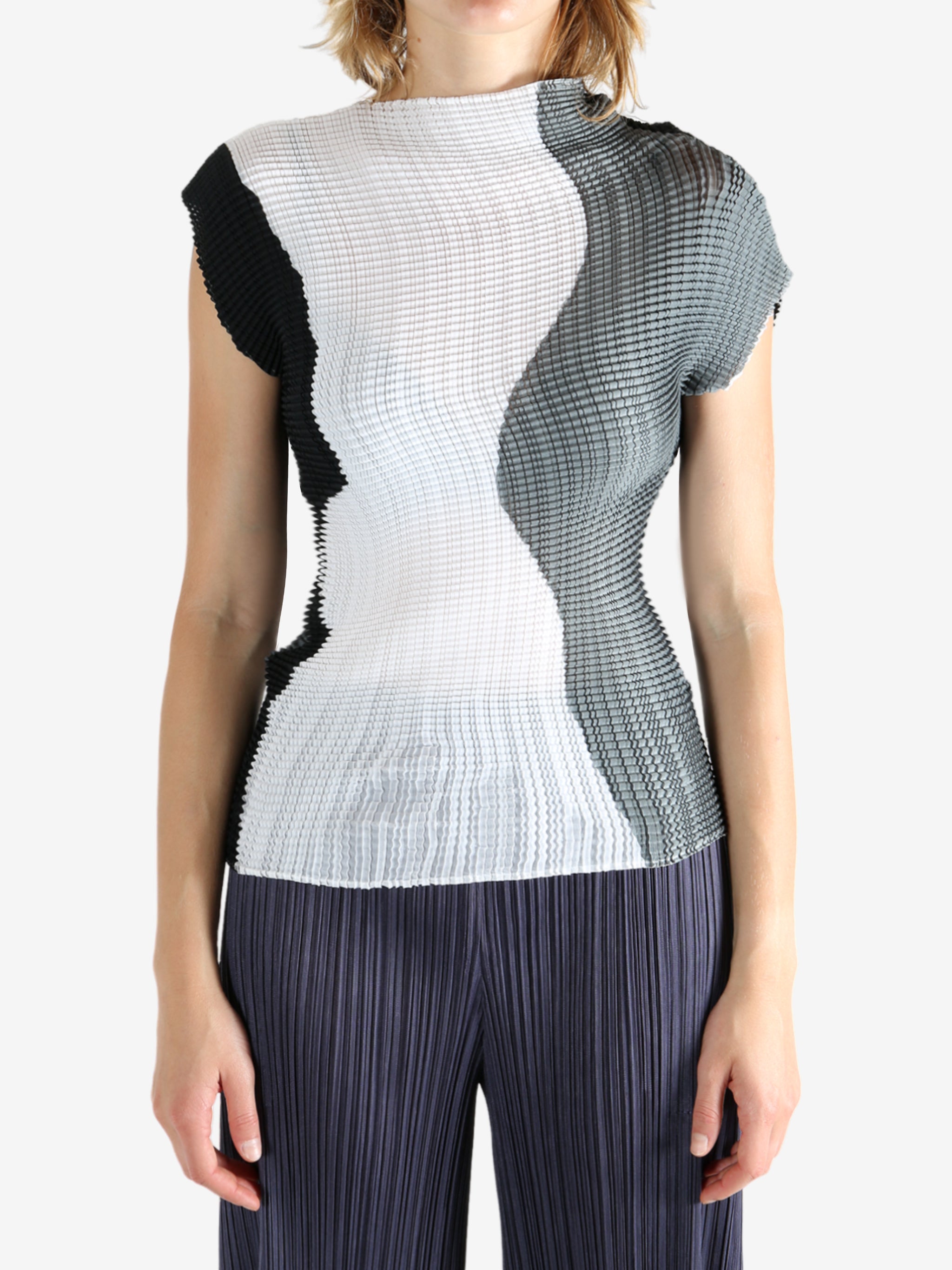 White shirt worn by a person, showing the shirt's fit