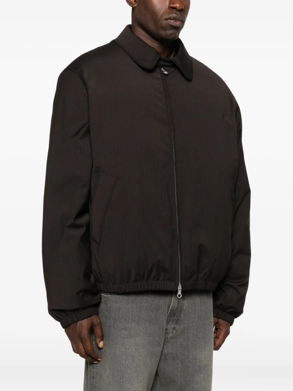 Brown coat worn by a person, showing the coat's fit