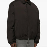 Brown coat worn by a person, showing the coat's fit