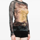 Black top worn by a person, showing the top fit