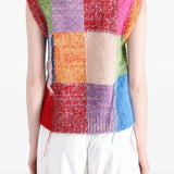 Red knitwear worn by a person, showing the knitwear fit