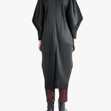 Black jackets-coats worn by a person, showing the jackets-coats'fit