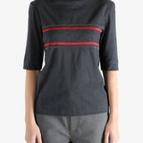 Grey t-shirts worn by a person, showing the t-shirts fit