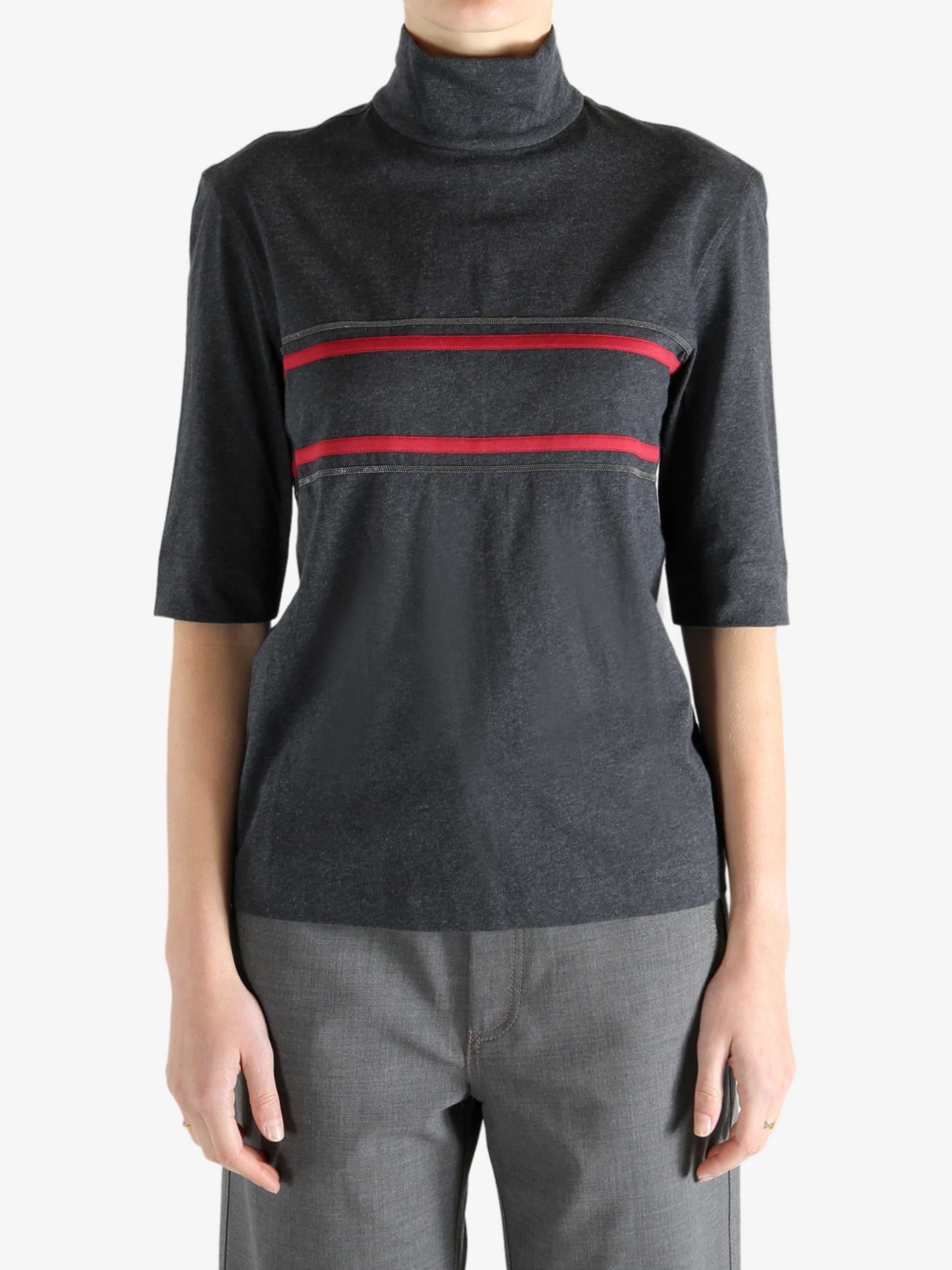 Grey t-shirts worn by a person, showing the t-shirts fit