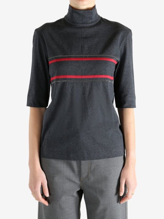 Grey t-shirts worn by a person, showing the t-shirts fit