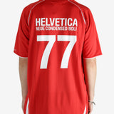 Red t-shirt worn by a person, showing the shirt's fit