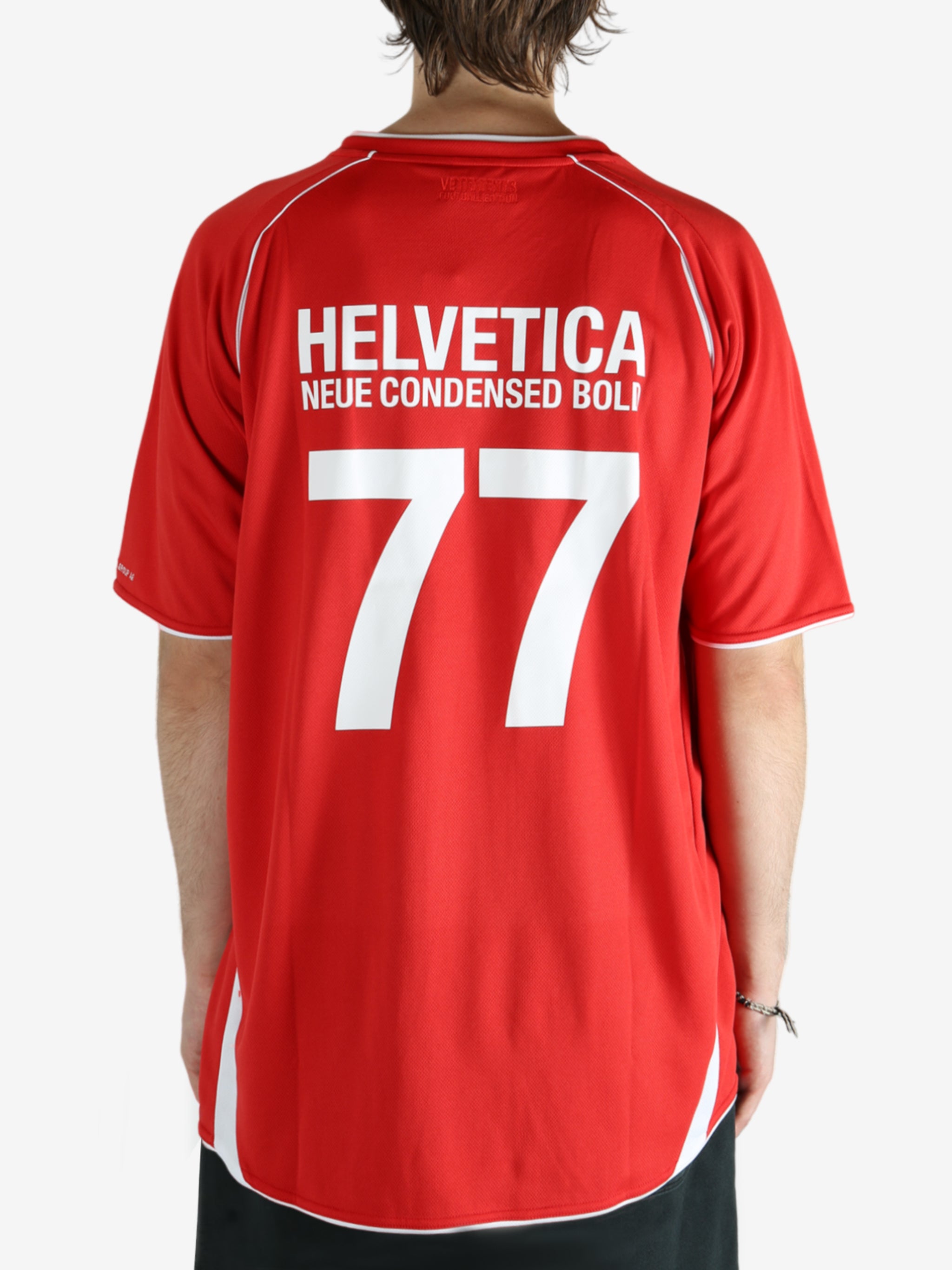 Red t-shirt worn by a person, showing the shirt's fit