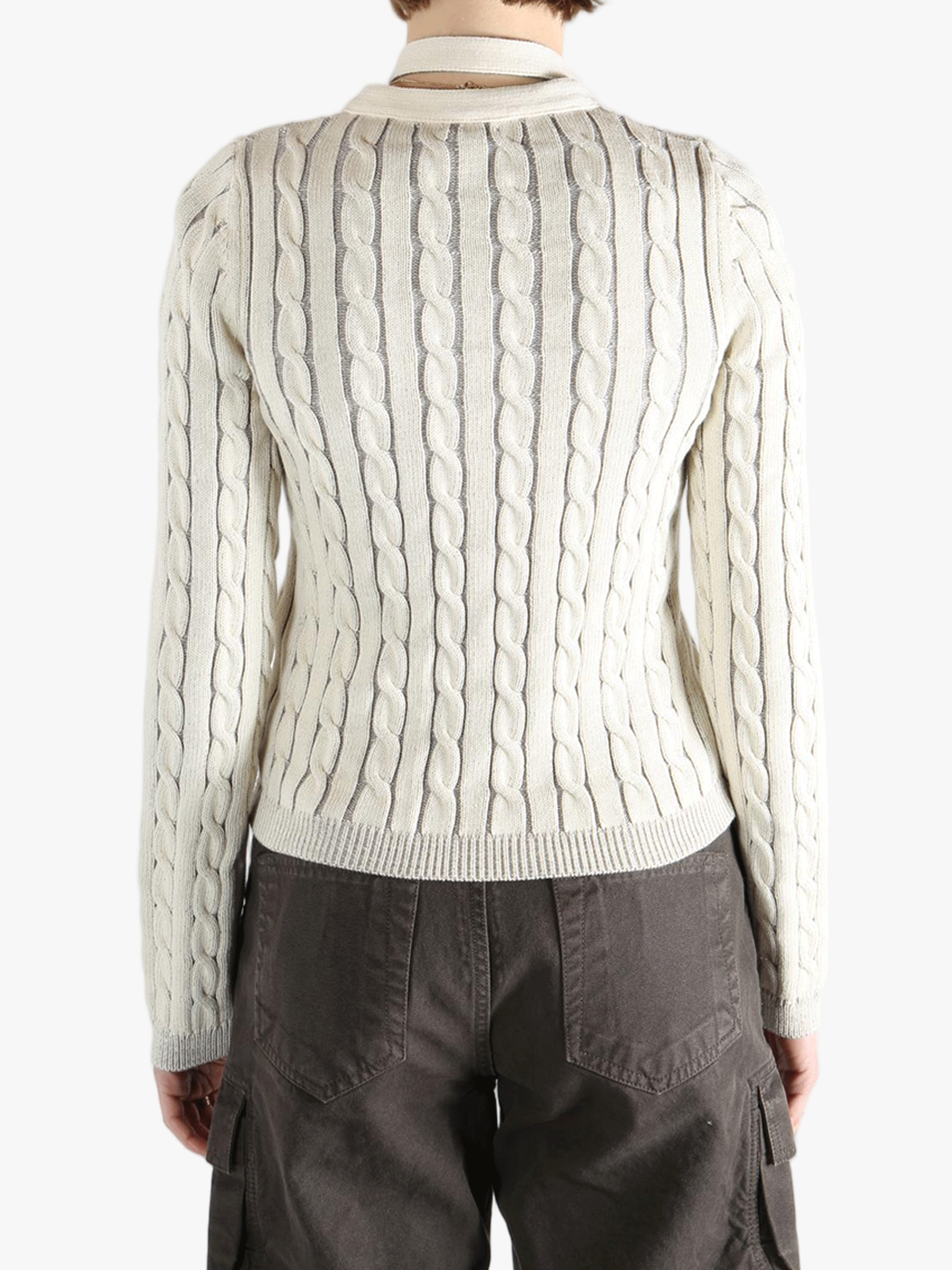 White knit long sleeve worn by a person, showing the loose fit.