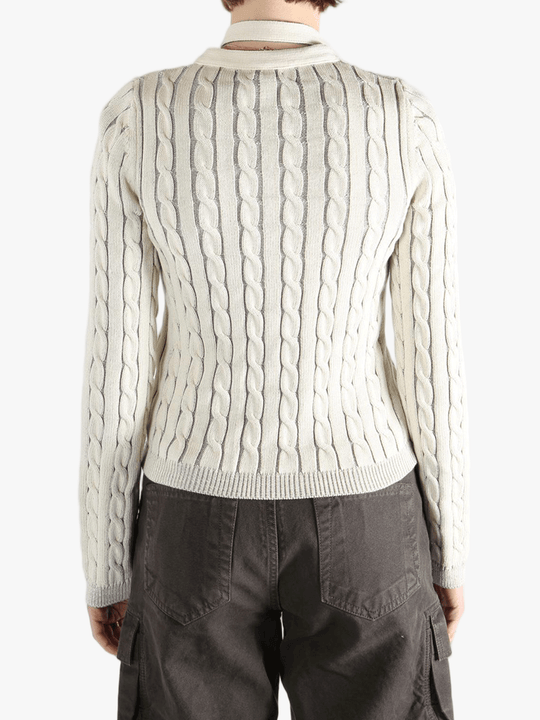 White knit long sleeve worn by a person, showing the loose fit.