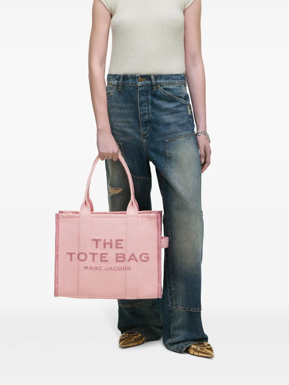 Pink bag, worn by a person, showing the bag's fit