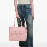 Pink bag, worn by a person, showing the bag's fit