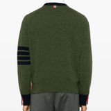 green knitwear worn by a person, showing the knitwear fit