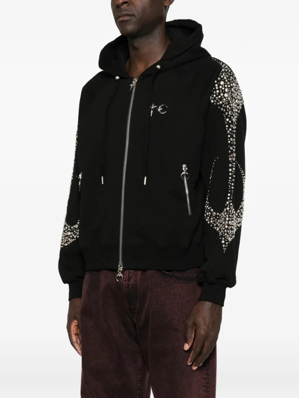 Black hoodie worn by a person, showing the hoodie fit