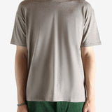 Brown t-shirt worn by a person, showing the shirt's fit