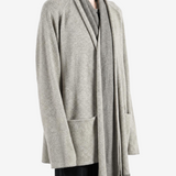 Grey knitwear worn by a person, showing the knitwear fit