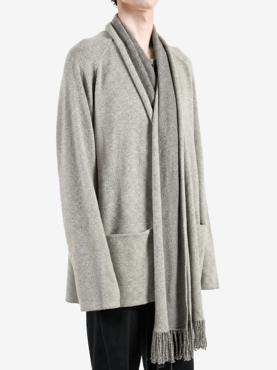 Grey knitwear worn by a person, showing the knitwear fit