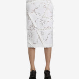 White skirt worn by a person, showing the skirt fit