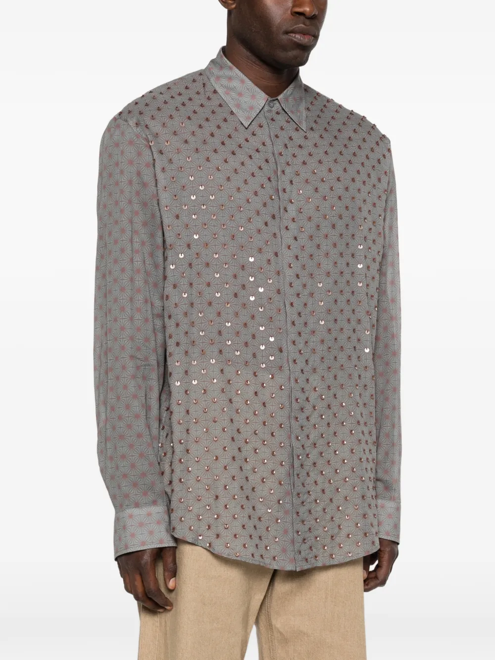 Grey shirt worn by a person, showing the shirt's fit