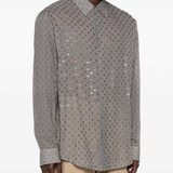 Grey shirt worn by a person, showing the shirt's fit