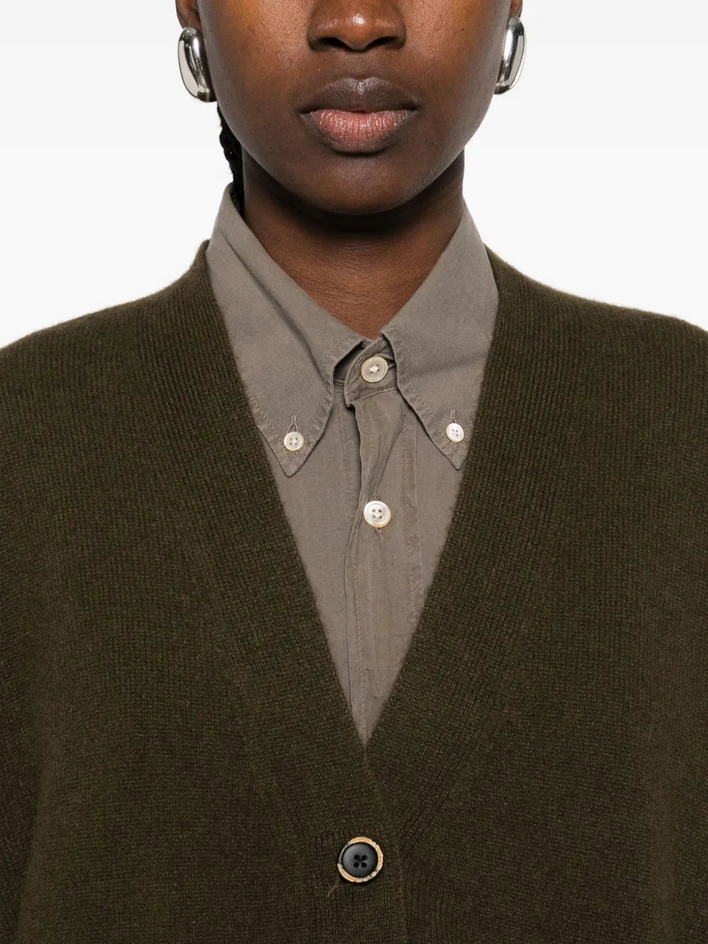 Close up of the green cardigan, showing texture of the cashmere fabric