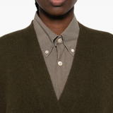 Close up of the green cardigan, showing texture of the cashmere fabric