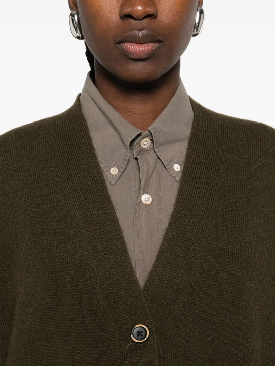 Close up of the green cardigan, showing texture of the cashmere fabric