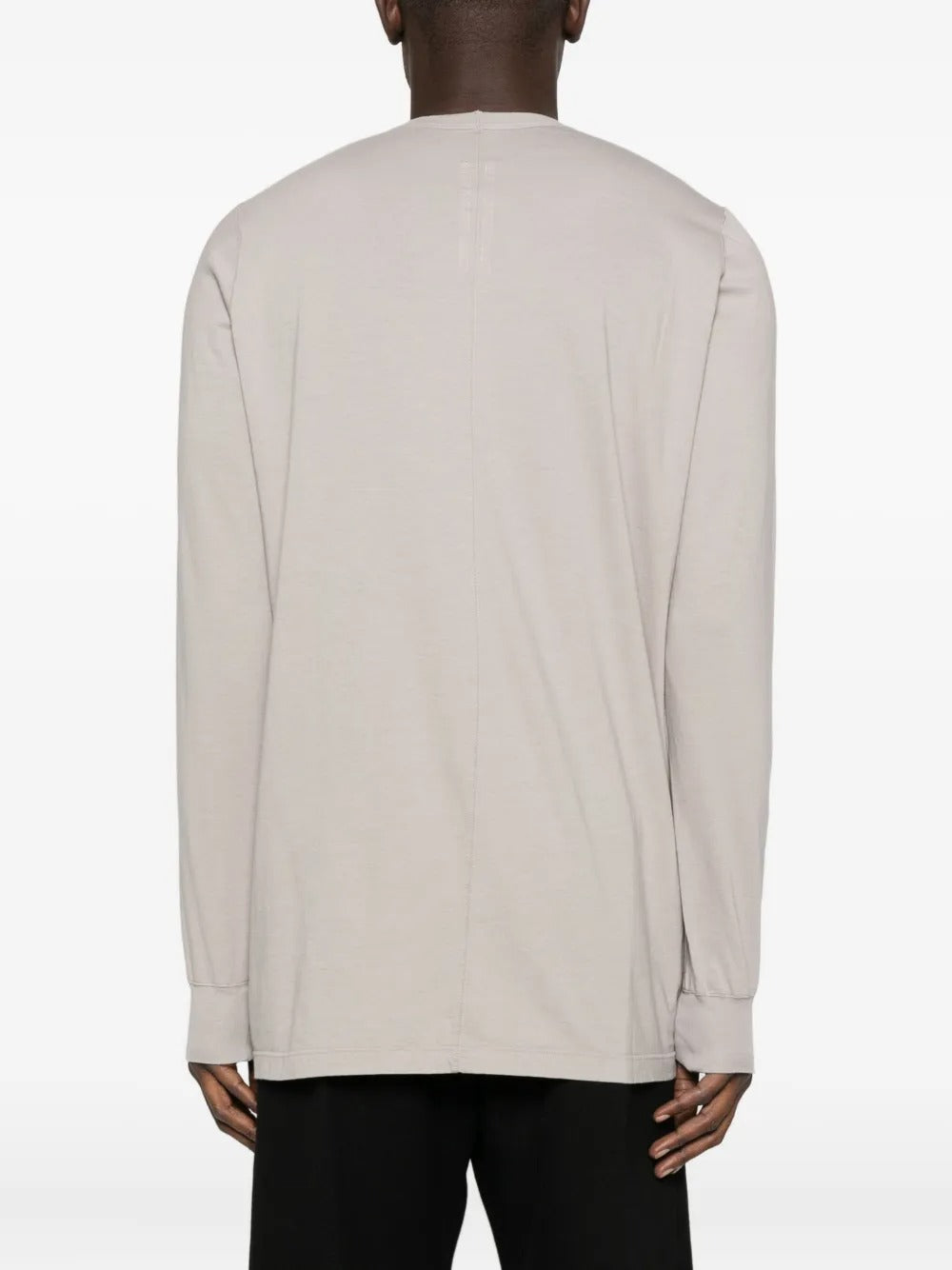 White t-shirt worn by a person, showing the shirt's fit