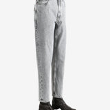 Grey pants worn by a person, showing the pants fit