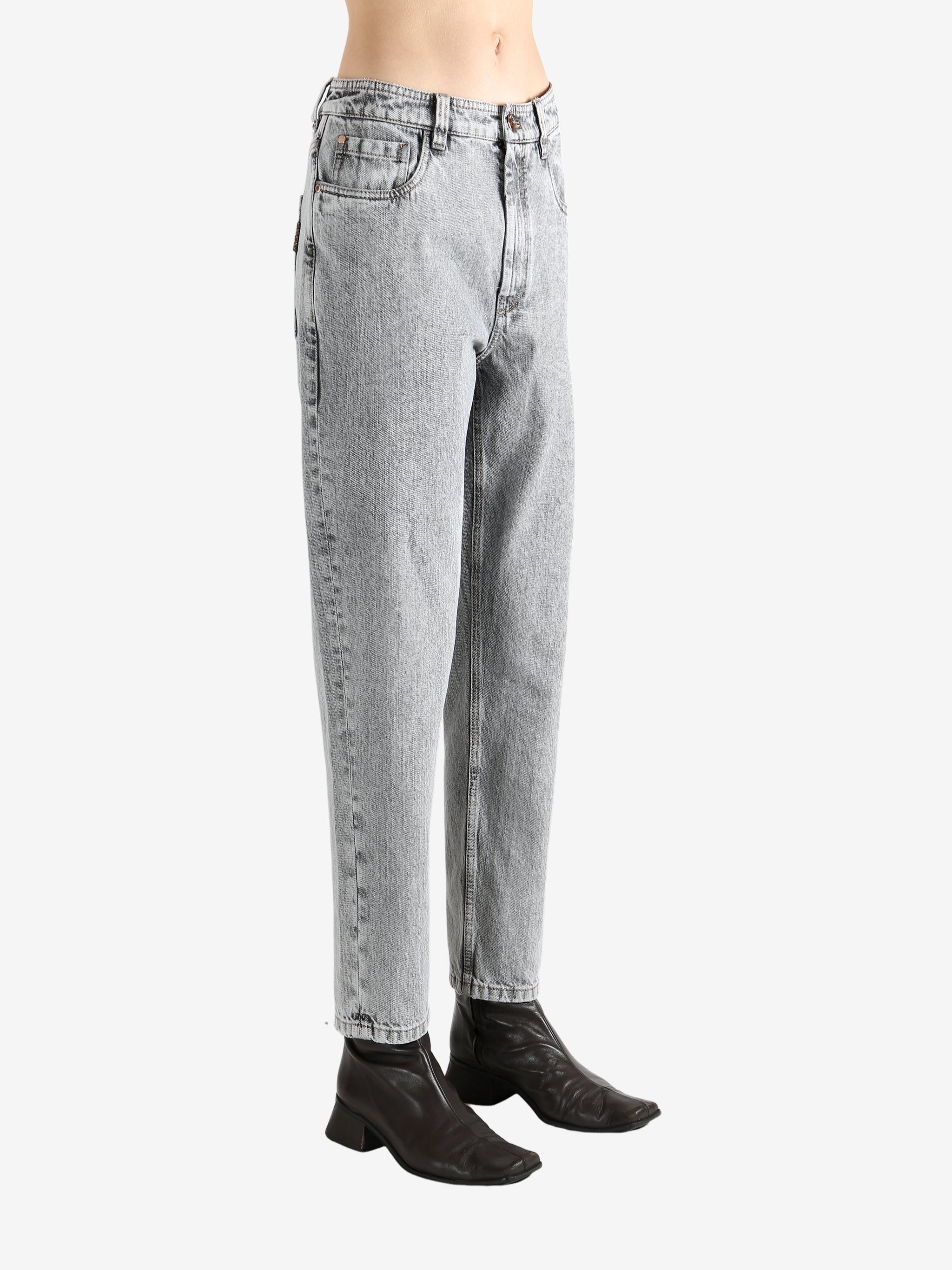Grey pants worn by a person, showing the pants fit