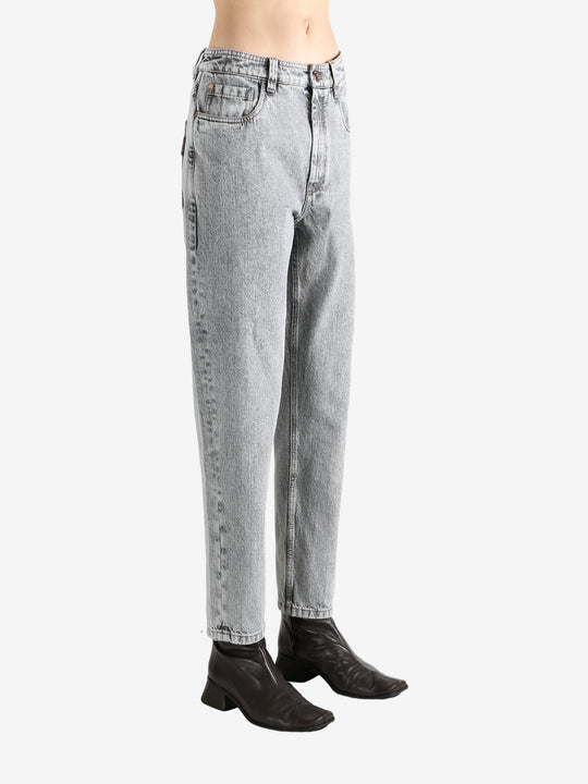 Grey pants worn by a person, showing the pants fit